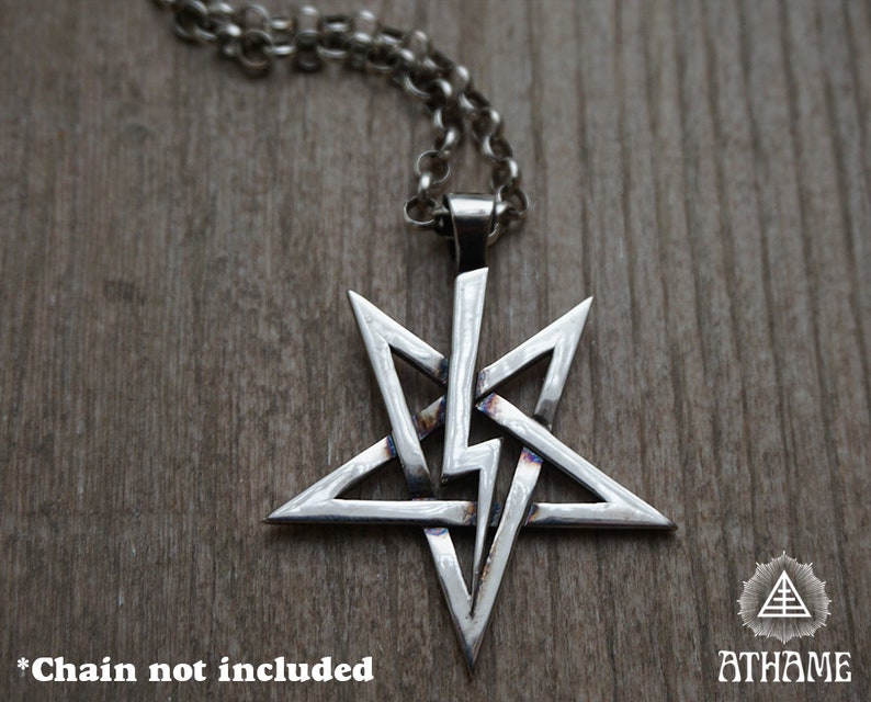 May include: A silver five-pointed star pendant with a complex, interwoven design. The pendant is on a silver chain, but the chain is not included. *Chain not included*