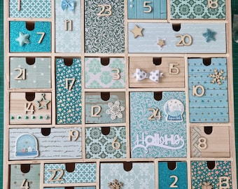 Perpetual wooden Advent calendar with a snowy turquoise night theme