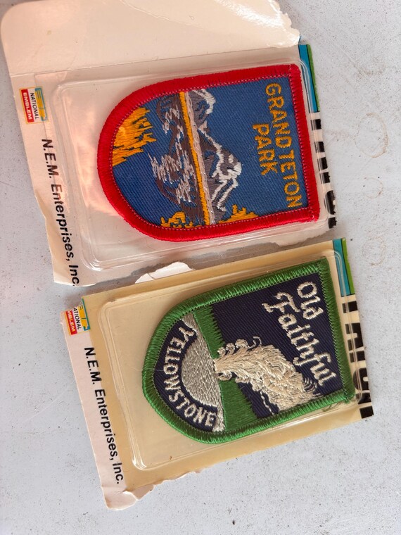 vintage, factory-sealed embroidered souvenir travel patches featuring Grand Teton National Park and Old Faithful, Yellowstone National Park