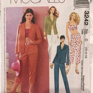 May include: McCall's sewing pattern for a women's pantsuit. The pattern includes a jacket, pants, and a top. The pattern is for sizes 10-12-14. The pattern is shown on three models wearing different color combinations of the outfit.