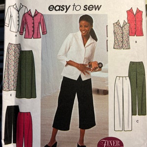 May include: A sewing pattern for a white blouse, a red and white gingham blouse, a black and white patterned vest, a red vest, a pair of black culottes, a pair of white pants, a pair of green pants, a pair of floral print pants, and a pair of red pants. The pattern is from Simplicity and says "easy to sew".