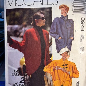 May include: McCall's sewing pattern number 3944 for a petite size jacket. The pattern includes three different styles: a red jacket with a shawl collar, a blue jacket with a tie at the neck, and a yellow jacket with a mandarin collar and decorative buttons.