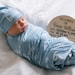 Personalized Baby Swaddle Blanket & optional newborn hat or bow - stretchy jersey with color background and white text
