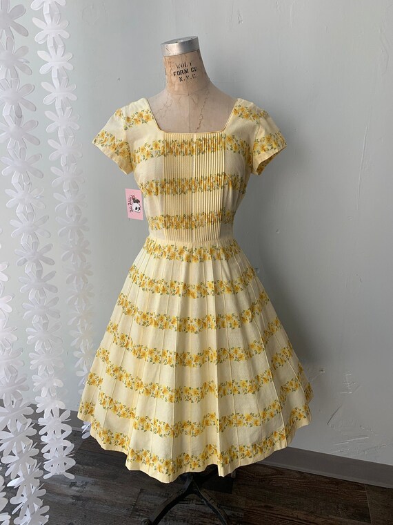 Vintage 1950s full swing dress with rainbow stripes in chevron style pattern dolman sleeve