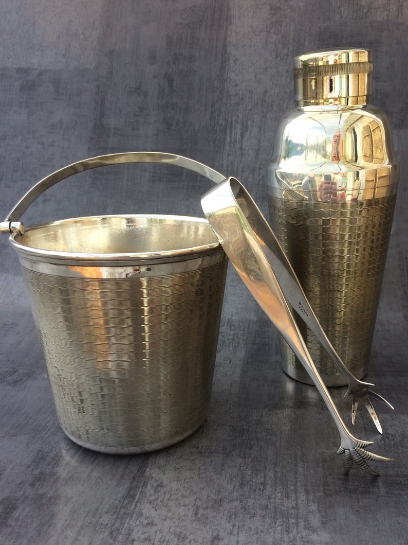 lot 150..very beautiful ENSEMBLE SEAU ice claws and SHAKER. Together bucket has ice and shaker.
