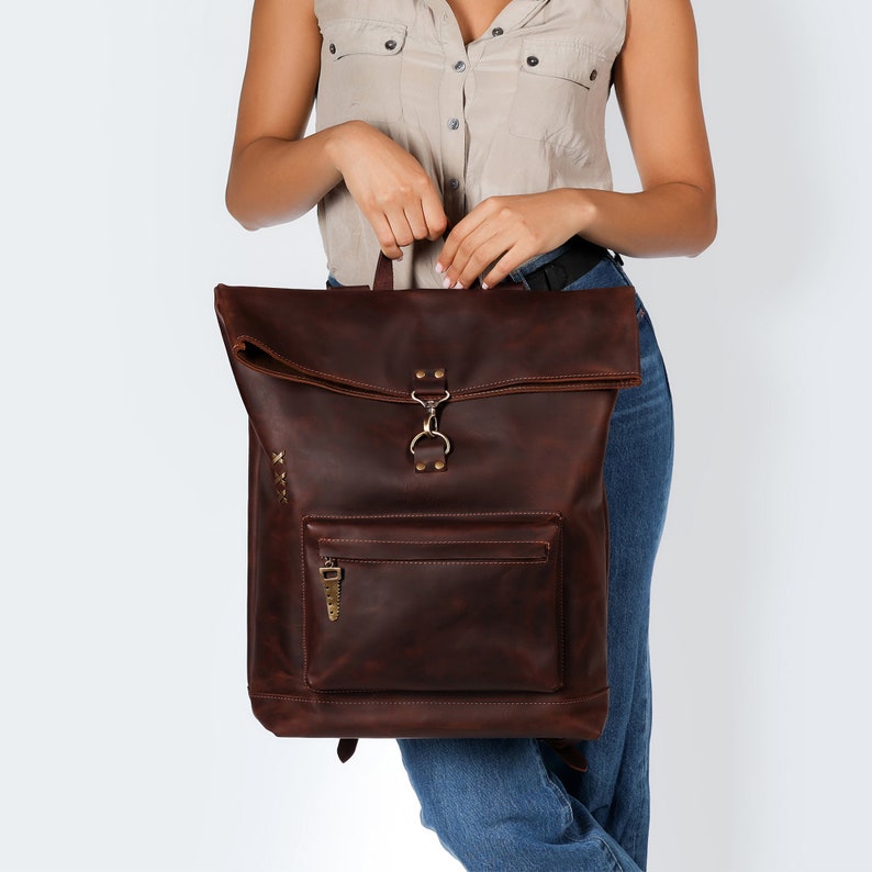 It's a practical leather backpack that promises durability and ease of use, with padded straps for added comfort.