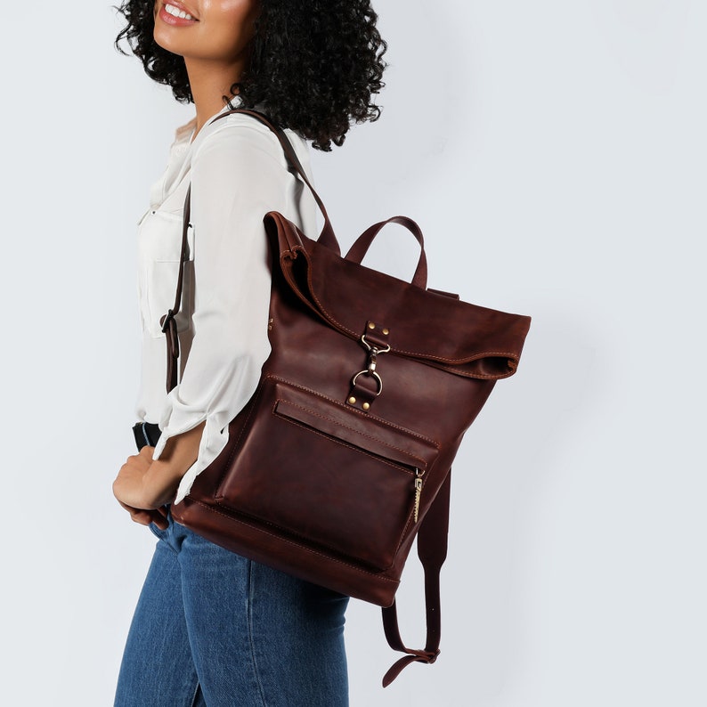 The dark brown color adds a timeless appeal, suitable for any occasion, whether you're on an outdoor adventure or navigating your daily commute.