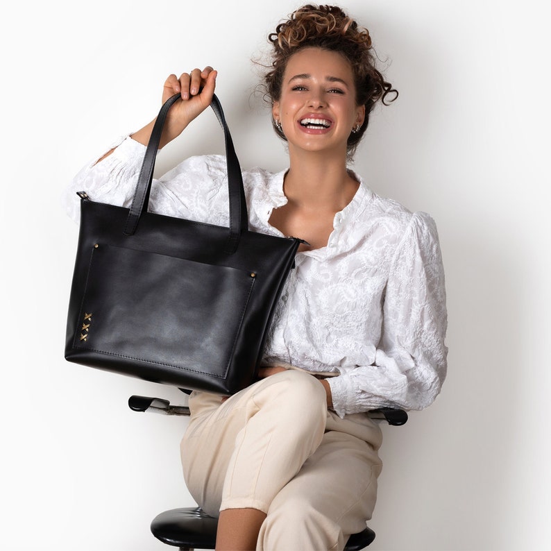 The leather bag is sewn from shiny high quality and thick leather. Perfect for work