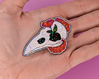 Pegatina floral de calavera de cuervo de 5 cm con acabado holográfico de estrella.
