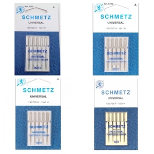 May include: Four packages of Schmetz Universal sewing machine needles. Each package contains six needles and is labeled with the size and type of needle. The packages are white with blue and gold accents.