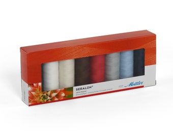 May include: A box of eight spools of Seralon thread, a 100% polyester thread, in various colors. The box is red with a clear window showing the spools. The brand name "Mettler" is printed on the box.