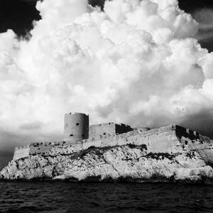 Ominous Storm clouds over Chateau d&#39;If, Marseille, France. Black/White travel photo. Prison in The Count of Monte Cristo. Digital Download