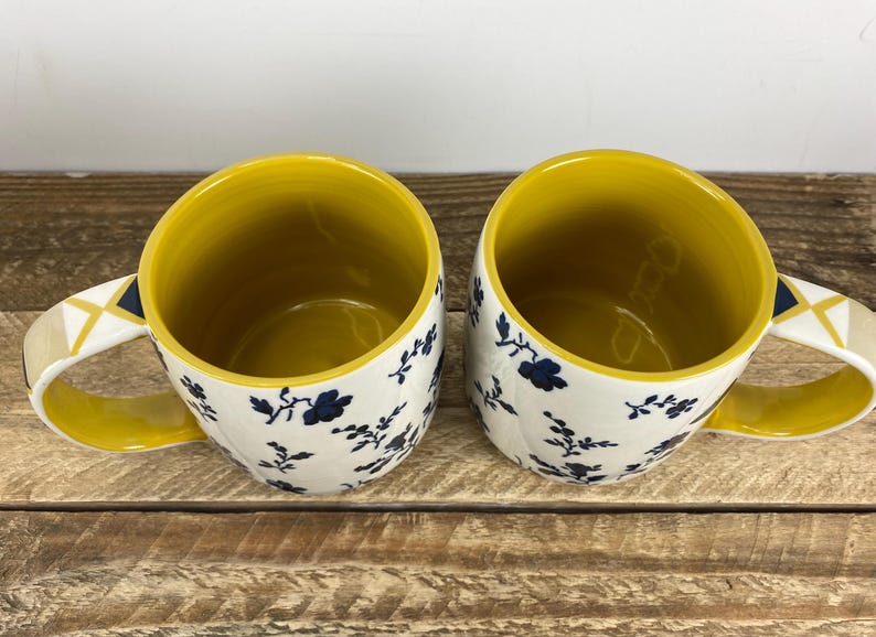 Set of 2 Anthropologie LOREN 12 oz Mugs, White with Blue Floral Motif, Yellow Inside, Geometric Handle, Butterfly Stamp image 2