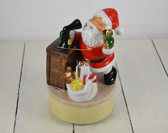 Vintage Japan SANTA CLAUS Rotating Music Box 6.25", Santa Claus is Coming to Town, Talking on the Phone, Present Sack.75", Green Mittens