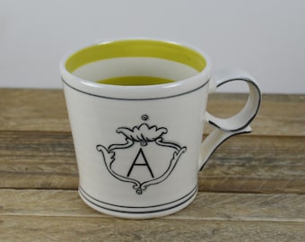 Molly Hatch 12 oz Initial Mug, Letter A, A Name, White with Black, Bright Green Stripe Inside, 3.5"