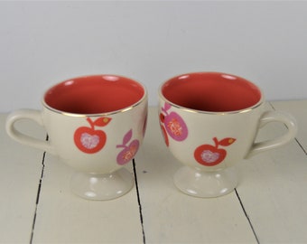 Set of 2 Anthropologie Fruit 8 oz Pedestal Cups, Ivory with Gold Trim, Bright Coral Pink Apples Purple Red, Black Bird Logo