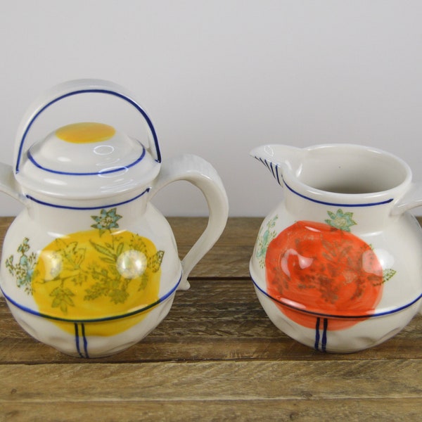 Anthropologie Sugar Bowl with Lid and 12 oz Creamer Set, White with Blue Bands Yellow Orange Circle over Flowers, Dimpled Surface