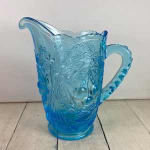 May include: A set of three ceramic mugs with a speckled, matte finish. The mugs are in shades of cream, light gray, and dark gray. Each mug has a simple, minimalist design, perfect for coffee or tea.