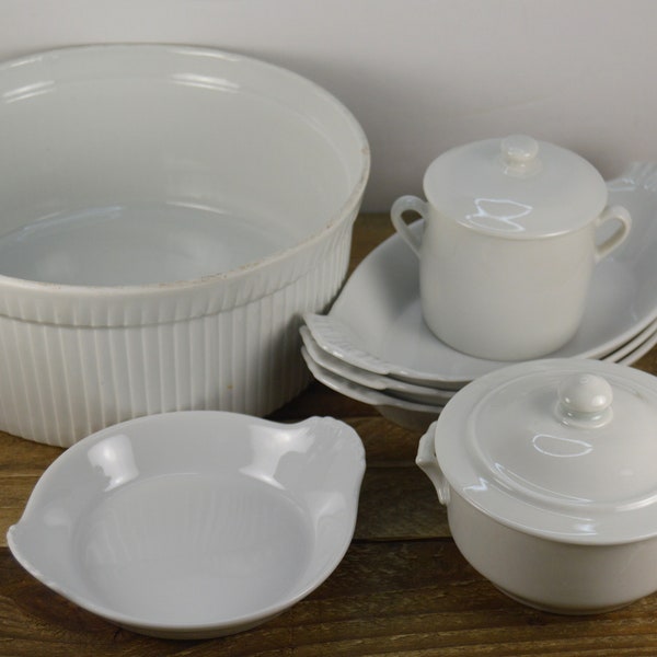 7 Pcs Apilco WHITEWARE, 1) 8.5" Round Souffle, 3) 9" Au Gratin, 1) Small Baker with Lid, 1) 2.75" Sugar Bowl with Lid, 1) 5.75" Egg Dish