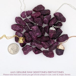 May include: A pile of raw purple gemstones, some with gold and silver accents, on a white background. The gemstones are arranged in a random pattern and are surrounded by two silver chains. The text "100% GENUINE RAW GEMSTONES/BIRTHSTONES" is at the bottom of the image. Please note that each stone you get will be unique in size, color & shape. Stones have natural inclusions & imperfections. Each device renders colors differently so what you receive might not look exactly like what's shown on the screen.