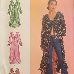 May include: Simplicity sewing pattern S9747, featuring three long-sleeve garment designs. The pattern includes sizes U.S. 8-16 and is designed and printed in the USA. The image shows a woman wearing a floral print garment.