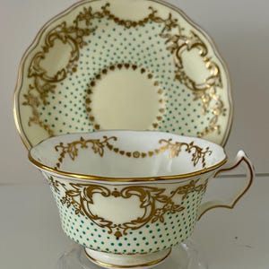 Antique Crescent China Tea Cup and Saucer: Turquoise Enamel, Rococo Design
