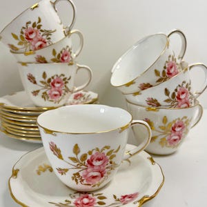 Royal Crown Derby Teacup & Saucer: Pink Roses, Gold Trim
