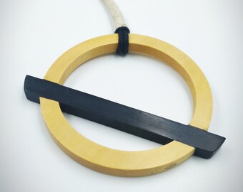 abstract geometric necklace in ebony wood and centenary boxwood unique piece handmade