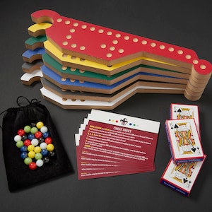 May include: A multi-colored wooden game board with a red, yellow, green, blue, and white finish. The game board is shaped like a horseshoe and has a series of holes along the top. The game board is accompanied by a set of playing cards and a cheat sheet with instructions.