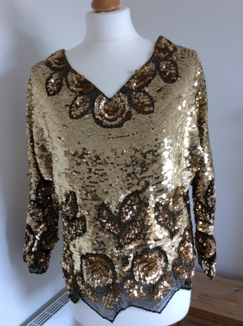 black top with gold sequins