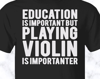 May include: A black short-sleeved t-shirt featuring white text printed on the front that reads: EDUCATION IS IMPORTANT BUT PLAYING VIOLIN IS IMPORTANTER. The shirt has a crew neckline and a standard fit, displaying the bold, capitalized lettering clearly.