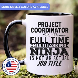 May include: A white ceramic mug with a black handle and interior rim. The mug features black text that reads: PROJECT COORDINATOR Only Because... FULL TIME MULTITASKING NINJA IS NOT AN ACTUAL JOB TITLE. A circular badge with the US flag is visible.