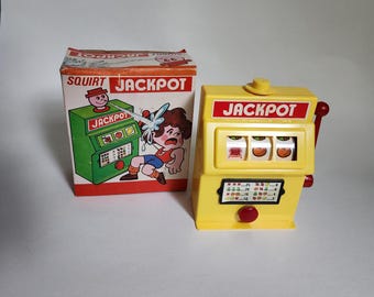 Vintage Squirt Jackpot, 1960&#39;s One Arm Bandit, Toy Slot Machine Squirts Water, Plastic Gag Gift. Made in Hong Kong.