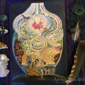 May include: A colorful, spiritual art print featuring a central vase-like shape with hummingbirds, a lotus flower, and a Native American figure with wolves. The artwork is surrounded by crystals and feathers, with the artist's signature at the bottom.