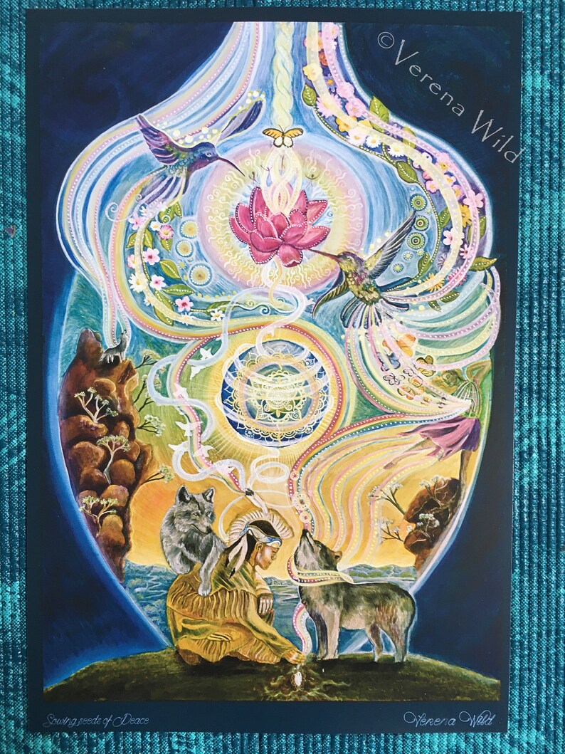 May include: A vibrant, spiritual art print titled "Sowing Seeds of Peace" by Verena Wild. The artwork features a central lotus flower, hummingbirds, wolves, and a Native American figure, all within a stylized, colorful design. The print has a dark blue border.