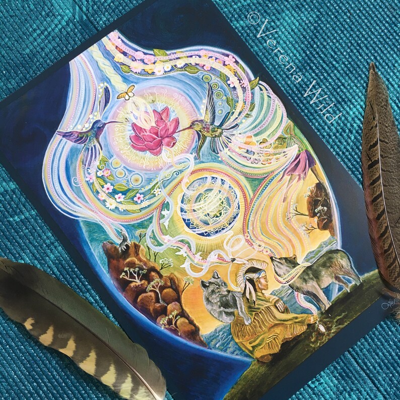 May include: An art print featuring a vibrant, dreamlike illustration with hummingbirds, a lotus flower, and wolves. The artwork includes the text "Verena Wild" and is accented by two feathers.