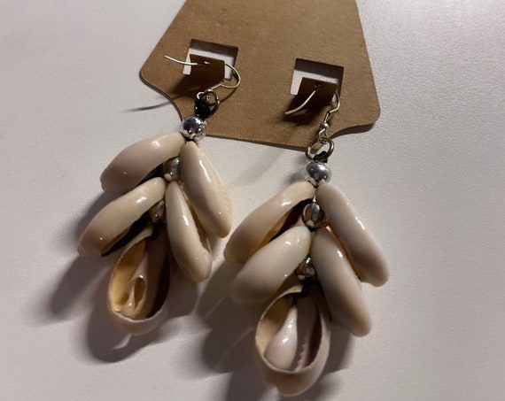 The “Shell” Earrings dangle
