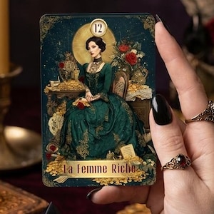 May include: A rectangular tarot card featuring the number 12 and the text La Femme Riche. The illustration depicts a person in a dark green gown seated amidst gold coins and red roses, set against a dark, ornate background with a golden halo.