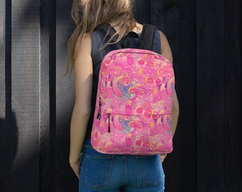 May include: A pink backpack with a psychedelic mushroom pattern. The backpack has a black zipper and adjustable straps.