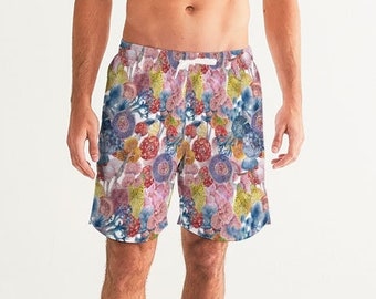 May include: A pair of men's swim trunks with a colorful floral print. The trunks have a drawstring waist and a relaxed fit.