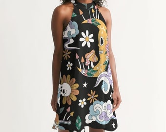May include: A black halter dress with a colorful print featuring a crescent moon, skull, flowers, mushrooms, and clouds.