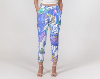 May include: White pants with a blue, pink, and yellow floral print. The pants have a wide waistband and a cropped length.