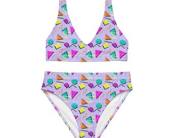 May include: A purple and white geometric print bikini with a high-waisted bottom and a triangle top.