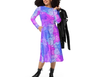 May include: A long-sleeved dress with a swirling pattern in shades of pink, purple, and blue. The dress has a fitted bodice and a flowing skirt.