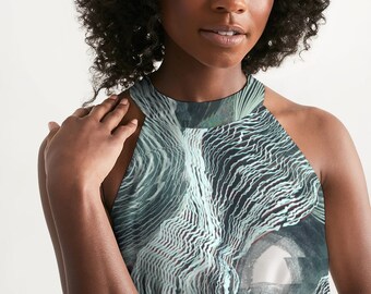May include: A halter top with a black and white abstract pattern. The pattern resembles a swirling, textured design with a light blue hue.
