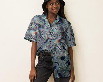 May include: A short-sleeved button-down shirt featuring a multi-colored wavy, psychedelic liquid marble pattern in shades of blue, gray, and iridescent highlights. The shirt has a classic collar, a front button closure, and a loose, relaxed fit.