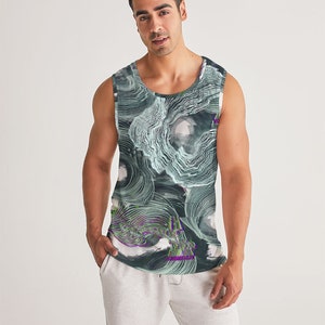 May include: A sleeveless tank top with a black, green, and white abstract pattern. The pattern features swirling lines and shapes.