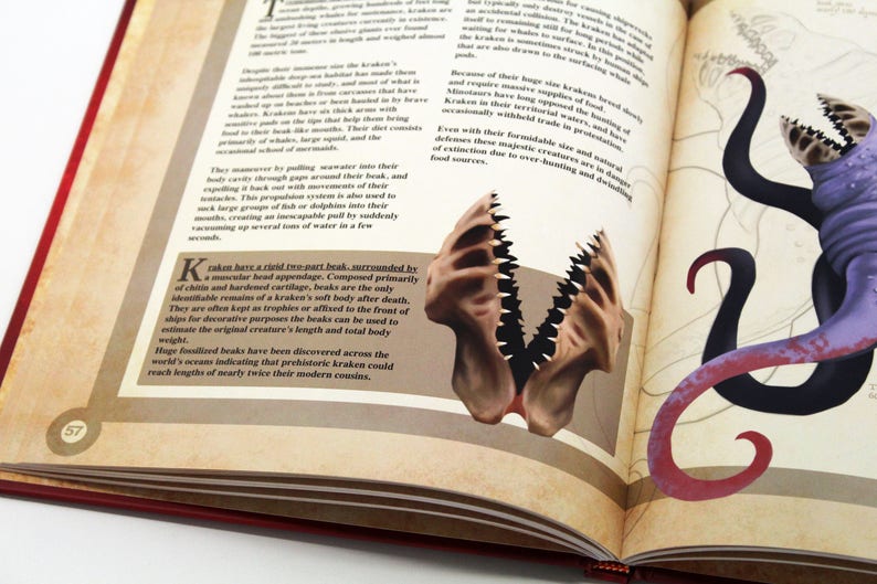 May include: Open book with illustrations of a kraken. One page features a detailed drawing of a kraken's beak, while the other side shows a purple and black kraken with tentacles. The book has a red cover.