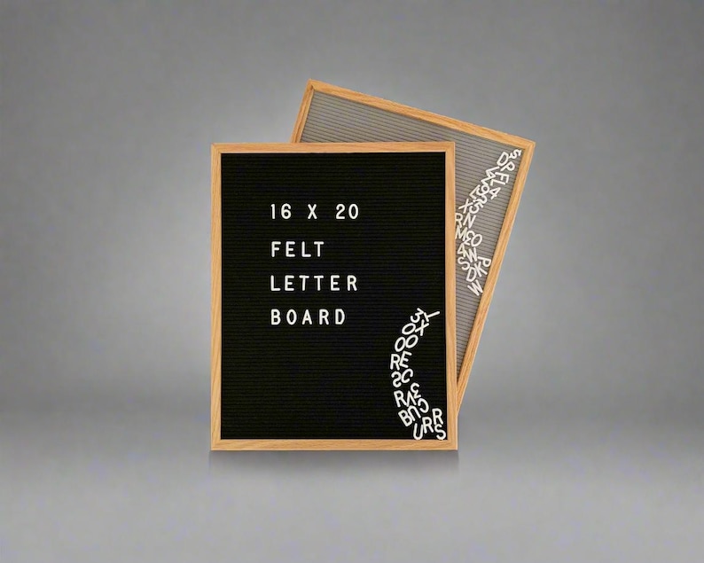 May include: A black felt letter board with a wooden frame. The board is 16 x 20 inches and has the words "Felt Letter Board" written on it. There are white plastic letters scattered around the board.