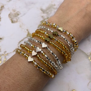 Silver and golden tone heart stretch bracelet. Valentine’s Day gift. Love beaded bracelet. Valentines Day bracelet. Perfect gift for her
